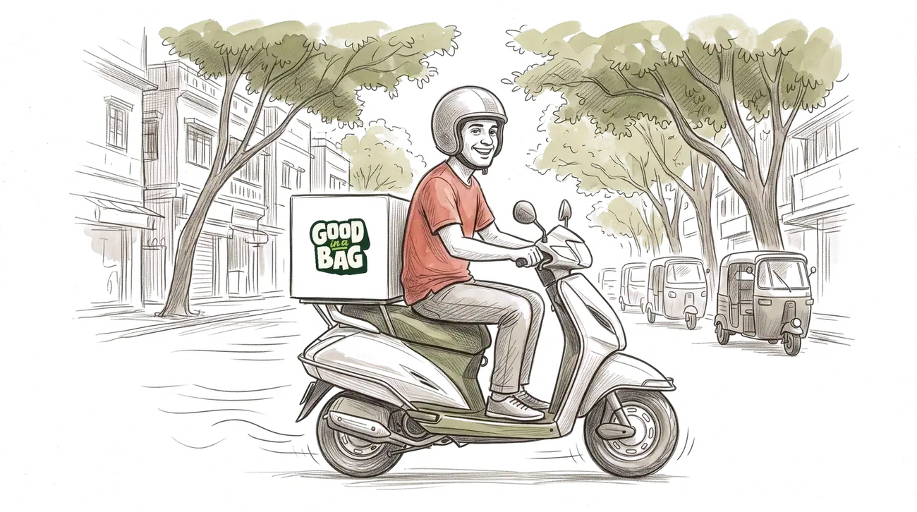 A delivery rider on a scooter on a Bengaluru street