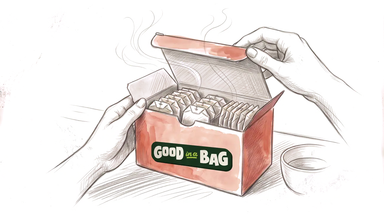 Hands opening the box of sachets